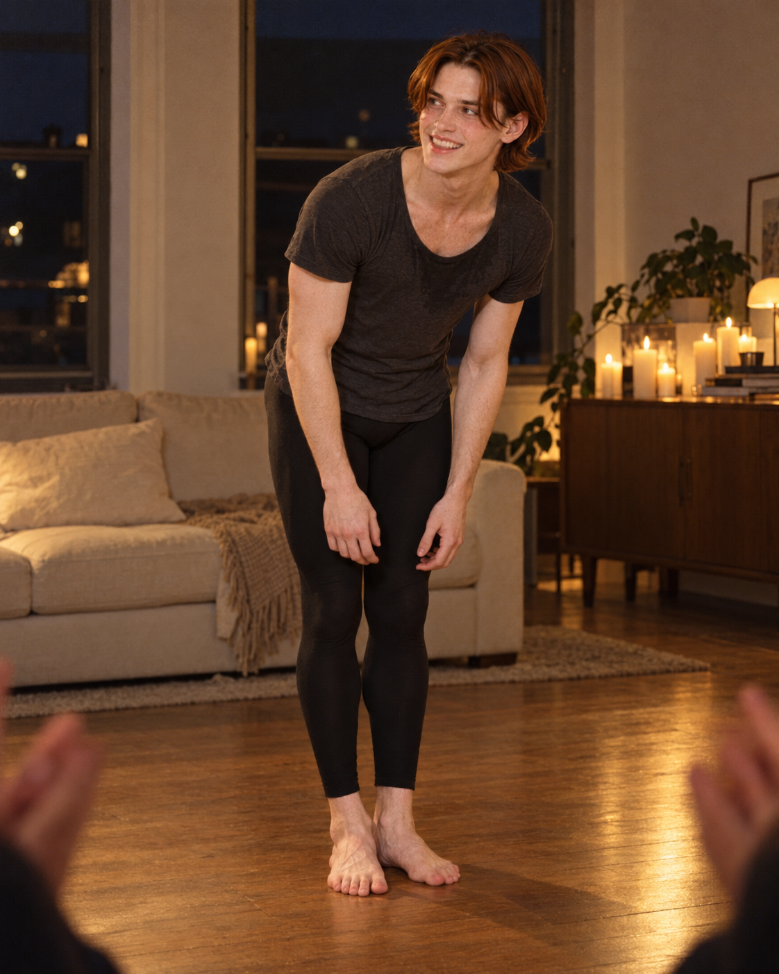 Finn bows after his living-room solo, turning toward an off-camera joke with an embarrassed, delighted smile.